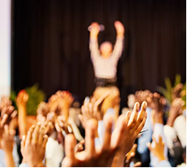A distributed team celebrating across a large venue