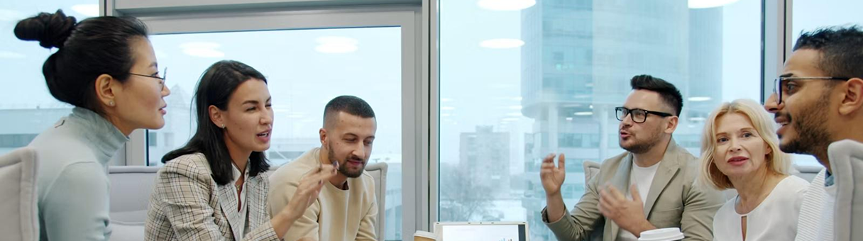 Colleagues discussing workforce records in an office