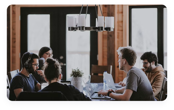A team reviewing a report together around a table