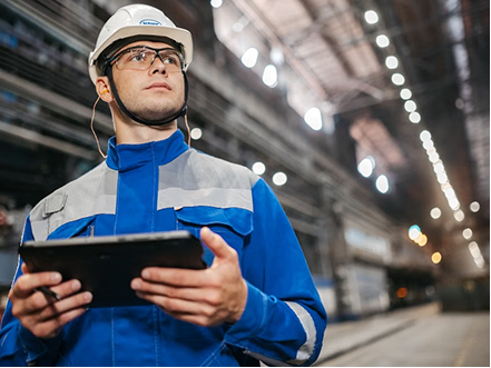 A worker checking their shift record on a handheld device